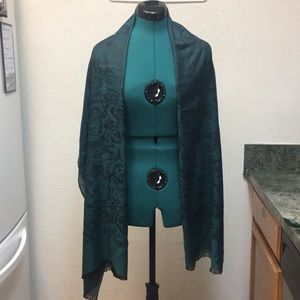 Turquoise black pattern scarf.